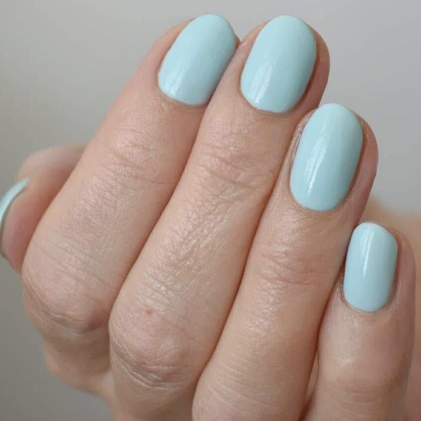 Pastel mint blue gel manicure on rounded nails