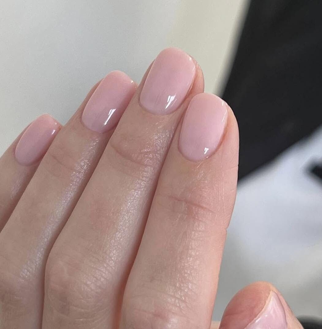 Sheer pink natural manicure with a glossy finish